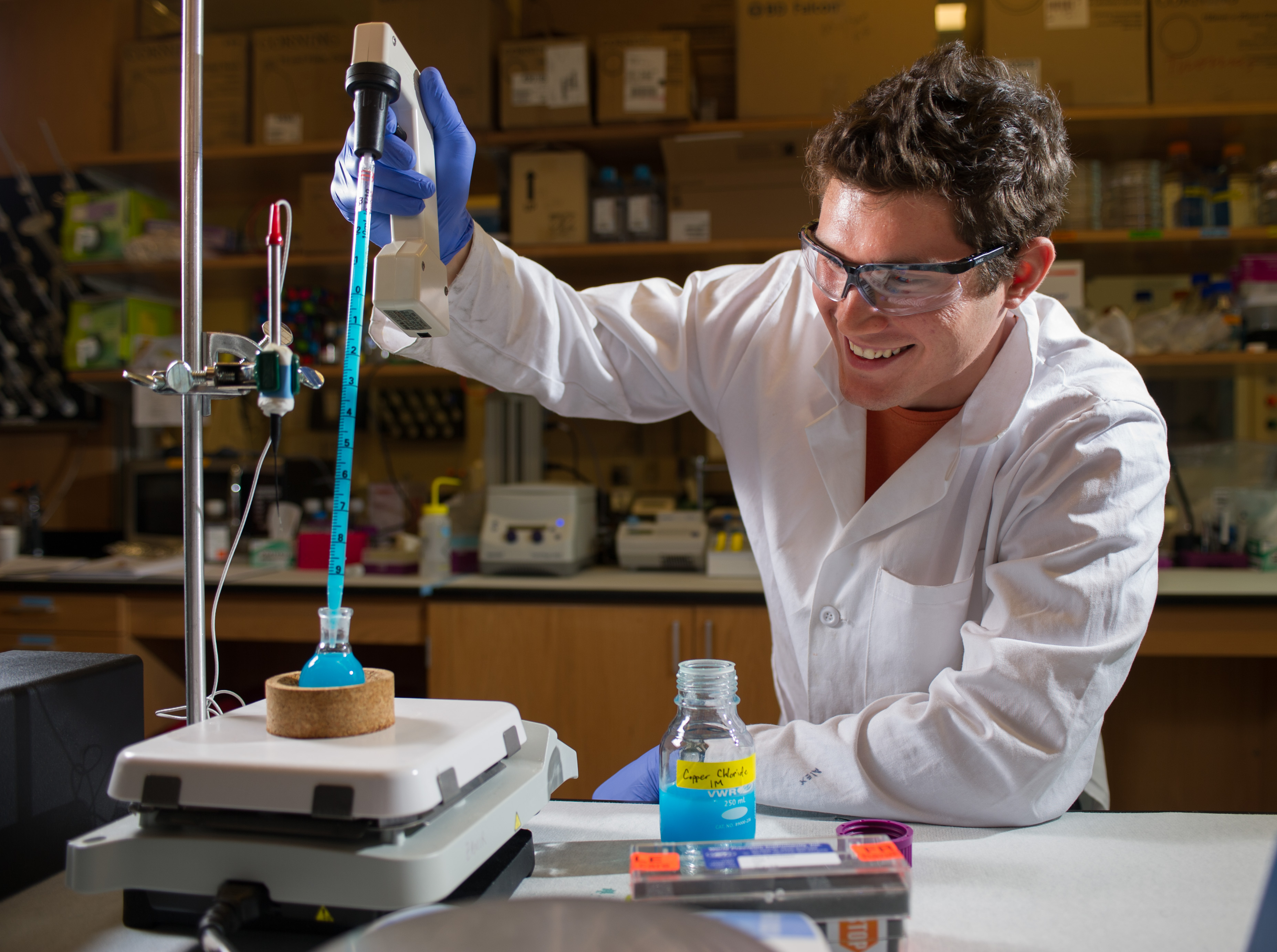 man pipetting chemicals